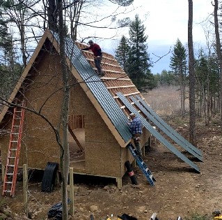 Camp Crew Working on Roofing Project | Land and Camps