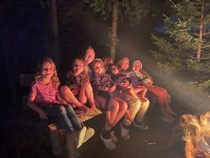 Family and kids enjoying campfire